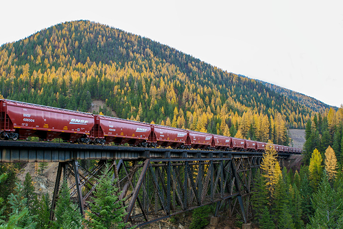 A grain train crosses the Java Trestle at Glacier National Park near Essex, Montana. A grain train crosses the Java Trestle at Glacier National Park near Essex, Montana.