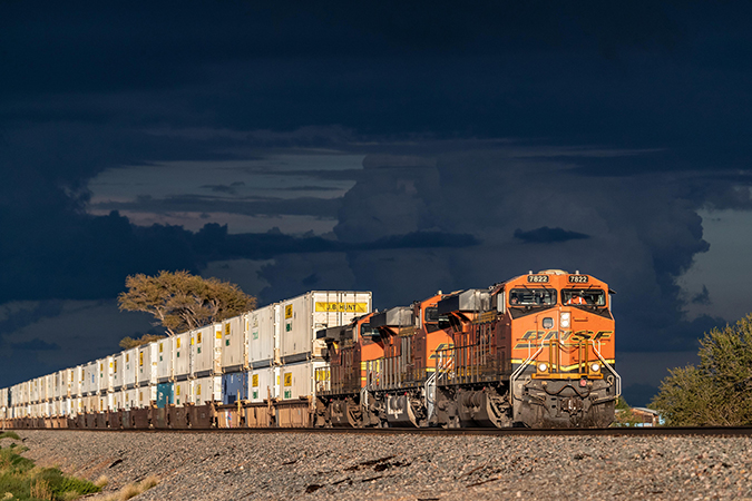 An intermodal train carries primarily J.B. Hunt containers on the Southern Transcon route near Willard, New Mexico. An intermodal train carries primarily J.B. Hunt containers on the Southern Transcon route near Willard, New Mexico.